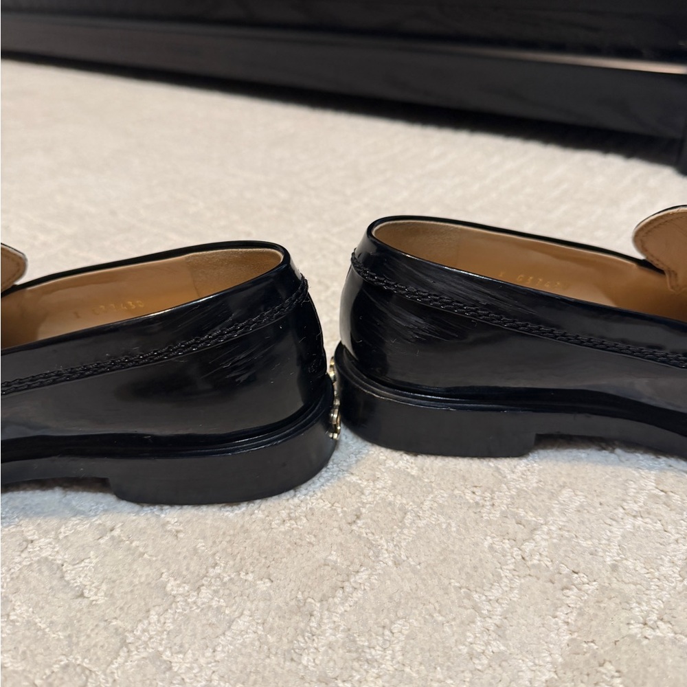 CHANEL Glossy Black Loafers with Gold Accents - Picture 4 of 5